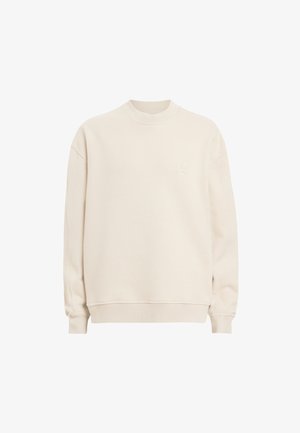 Crewneck sweatshirt i lys beige, lavet af blødt stof. Har ribbede manchetter og hals, med diskret broderi på brystet.