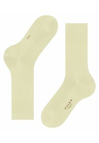 Jasnożółte skarpetki typu crew o gładkiej teksturze, bezszwowym designie palców oraz subtelnym logo marki nadrukowanym na podeszwie.