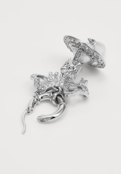 Broșă argintie în formă de suzetă, cu o perlă, un design floral delicat și accente strălucitoare. Finisaj de metal neted și lucios.