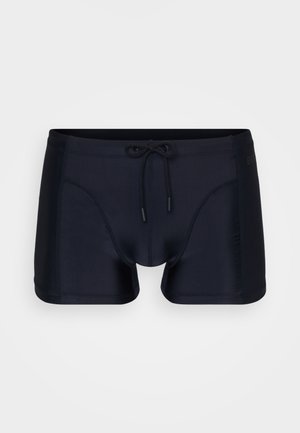 Navy Schwimmshorts aus glattem Stoff, mit einem Zugbandbund, seitlichen Taschen und einem taillierten Design mit kontrastierenden Paneeldetails.
