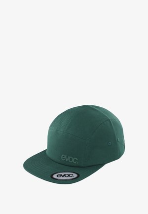 Green five-panel cap made from fabric, featuring a flat brim, stitched accents, and a circular logo patch on the front.