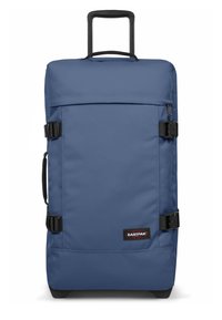 Blue rolling duffel bag with a sturdy handle, adjustable straps, textured fabric, and a black Eastpak logo patch on the front.