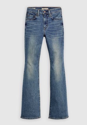 Jean en denim bleu évasé avec décoloration légère, design à cinq poches, ferrures métalliques et ourlets cousus, présentant une coupe classique et une texture lisse.