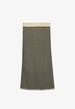 Dzianinowa spódnica przed kolano w czarno-białe poziome pasy, z beżowym paskiem w talii i falowanym dołem na białym tle.