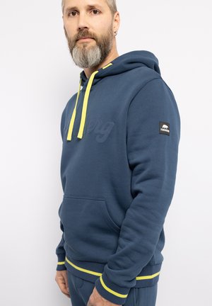 Kapuzensweatshirt aus dunkelblauem Baumwollmix mit gelben Akzentzugbändern. Verfügt über eine Fronttasche sowie gerippte Bündchen und Saum. Logo auf der Brust und am Ärmel.
