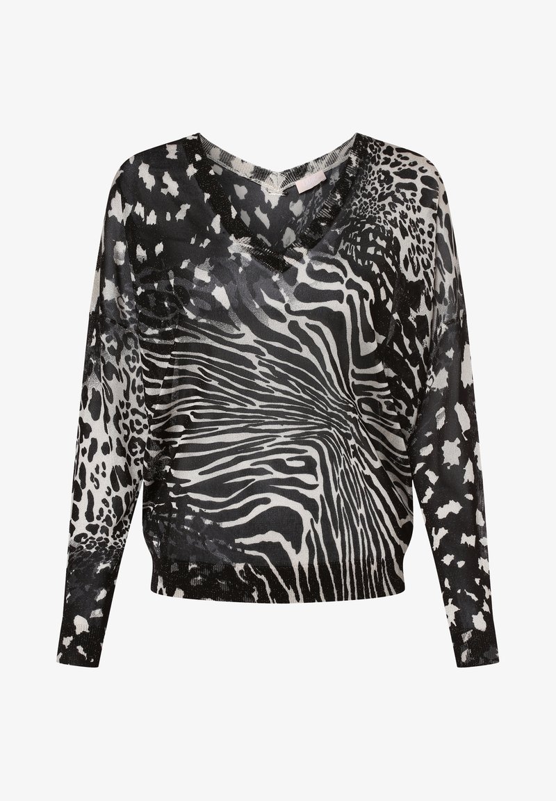 Blouse à manches longues transparente avec motifs imprimés animaux mélangés en noir et blanc et décolleté en V.