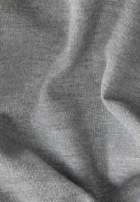 Gray fabric with a slight sheen, featuring a soft, textured surface and subtle stretch. The material has small, sparkly fibers throughout.