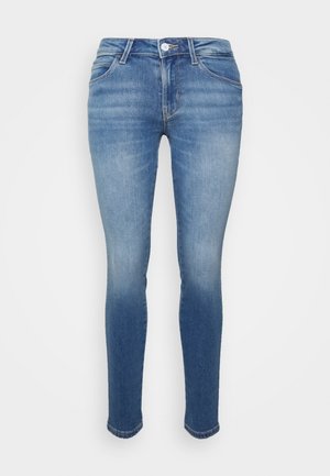 Skinny jeans van lichtblauwe denim, met een hoge taille, een vijf-pocket ontwerp, een lichte vervaging richting de zoom en een knoopsluiting.
