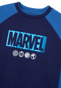 Navy blue shirt with contrasting blue raglan sleeves. Features the "MARVEL" logo and icons of characters in white on the front.