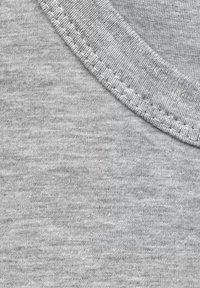 Light gray cotton fabric with a smooth texture, featuring a ribbed crew neckline and straight stitching along the edges.