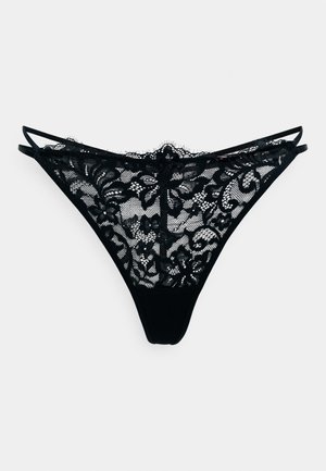 Zwarte kanten string met bloemenpatroon, met een transparante voorkant, een effen achterkant en dunne verstelbare bandjes. Glad materiaal met ingewikkelde details.