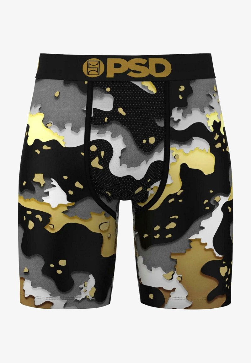 Bañadores tipo boxers con un patrón de camuflaje en negro, gris y dorado, fabricados con un tejido de malla transpirable, con una cinturilla negra que lleva un logotipo dorado.