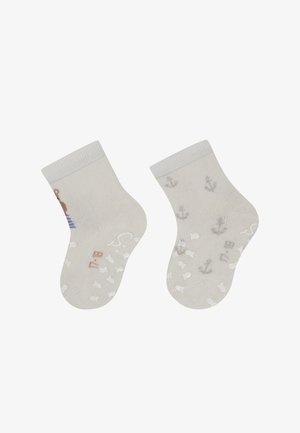 Light beige ankle socks featuring a blue and white striped design, anchor patterns, and a soft ribbed cuff. Textured soles for grip.
