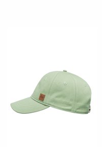 Light green cap with a curved brim, fabric texture, and a brown rectangular logo patch. Features ventilation eyelets and adjustable strap.