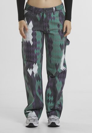 Baggy cargo pants with a diamond pattern in green, purple, and white; features side pockets and a button-up waist closure.
