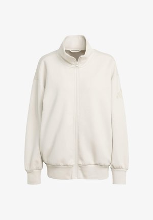 Cremfarbener Reißverschluss-Sweatshirt mit hohem Kragen, überschnittenen Schultern, gerippten Bündchen und Saum, aus glattem Material gefertigt, mit einem dezenten Logo-Detail am Ärmel.