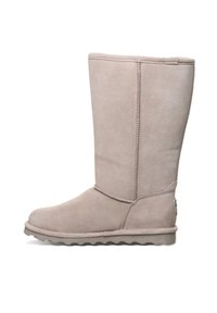 Beige hohe Stiefel aus Wildleder mit runder Zehenpartie und Gummisohle. Besitzt vertikale Nahtdetails und eine weiche, strukturierte Oberfläche.