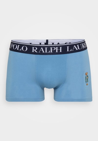 Ανοιχτόμπλέ εφαρμοστά σλίπ με ναυτική ελαστική ζώνη που φέρει τη γραφή "POLO RALPH LAUREN" και ένα κεντημένο αρκούδο σε πράσινη στολή.