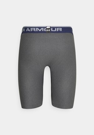 Gray athletic shorts made of stretchy fabric, featuring a navy waistband with white logos and a smooth texture. Mid-thigh length design.