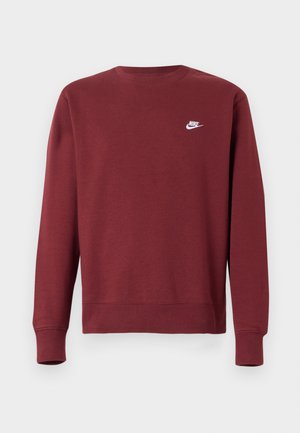 Felpa bordeaux realizzata in misto cotone, presenta maniche lunghe, scollo rotondo, polsini a coste e un piccolo logo Nike bianco sul petto.