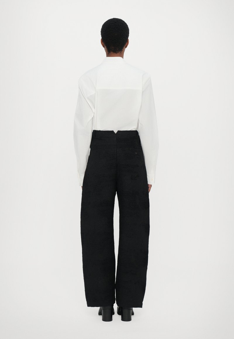 Henrik Vibskov ONE PANTS - Trousers - fishes black