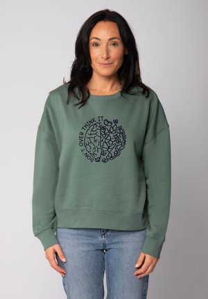 Grüne Sweatshirt mit lässiger Passform, versehen mit einem marineblauen Grafikdesign eines Gehirns und Blumen. Weicher Stoff, lange Ärmel, gerippter Saum.