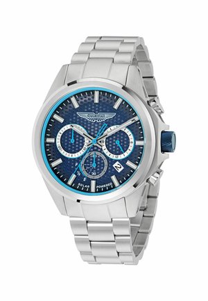 Reloj de acero inoxidable plateado con una esfera texturizada azul, función de fecha, subesferas de cronógrafo y un acento azul en la corona.