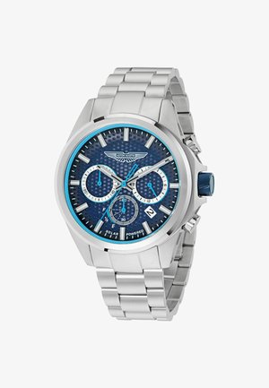 Srebrny zegarek ze stali nierdzewnej z niebieską teksturowaną tarczą, funkcją daty, pod tarczami chronografu oraz niebieskim akcentem na koronce.