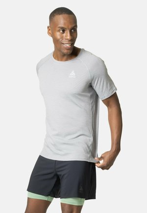 Light gray athletic t-shirt with a round neckline and short sleeves, featuring a subtle texture and a small logo on the chest. Black shorts underneath.