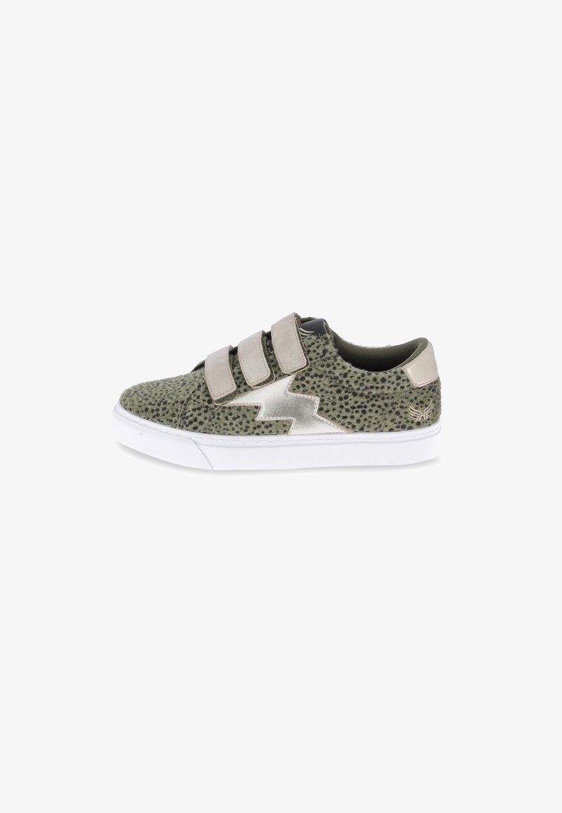 Low-top sneaker with green spotted pattern, metallic lightning bolt design, three beige Velcro straps, and white sole, side view.