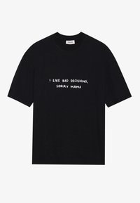 Black cotton t-shirt featuring short sleeves and crew neckline. White printed text reads, "I LIKE BAD DECISIONS, SORRY MAMA."