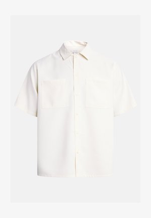 Short-sleeve button-up shirt in off-white, featuring a collar, two chest pockets, smooth fabric, and a loose fit.