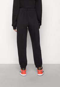 Jordan W J FLIGHT FLC PANT CORE - Träningsbyxor - black