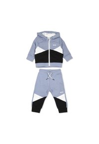 Twee-delige trainingsoutfitset in lichtblauw, bestaande uit een zip-up hoodie met zwarte en witte geometrische accenten en bijpassende sweatpants met drawstring.
