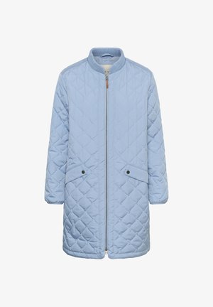 Hele sinine tikitud jakk tõmblukuga, soonikkoega krae ja kahe küljetaskuga, millel on mustad trukid. Keskmise pikkusega disain.