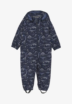 Salopette bleu marine avec motif de squelette de dinosaure, équipée d'une fermeture éclair intégrale, de poignets élastiques et d'une capuche. Fabriquée en matériau imperméable.