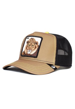 Casquette trucker en mesh beige et noir avec un patch lion étiqueté "KING" sur le panneau avant et des surpiqûres jaunes sur la visière.