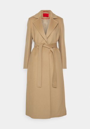 Beige long coat with a notched lapel, belted waist, and straight cut. Smooth texture with a red interior lining. No visible hardware.
