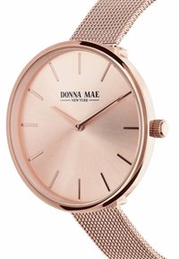 Rosegouden metalen horloge met een glad, mat wijzerplaat en slanke uurmarkeringen. Heeft een mesh bandje en een zijkroon voor het aanpassen van de tijd.