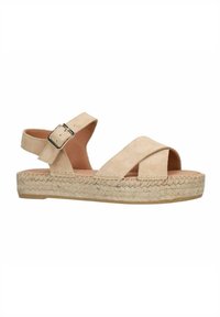 Beige suède sandalen met kruislussen en een verstelbare enkelgesp. De geweven jute zool voegt textuur en contrast toe aan het gladde bovenwerk.
