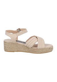 Beige espadrille wedge sandals with cross-over straps, textured fabric, and a jute-wrapped sole. Adjustable ankle strap for secure fit.