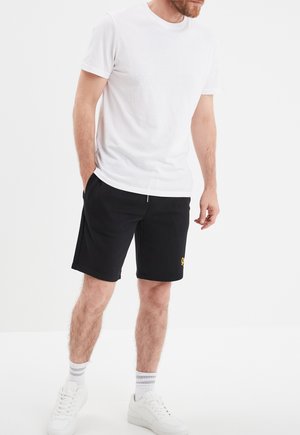 MIT SCHIEBER - Jogginghose - black