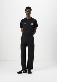 Jack & Jones JPSTKARL KURTIS SNAP TECH - Pantalones cargo - black