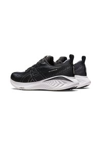 Scarpe da allenamento nere con tomaia in mesh texturizzato, design dinamico, suola bianca imbottita e marchio discreto sui lati e sul tallone.