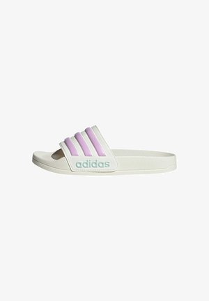 Adidas slide, white with three purple rubber stripes. Features a textured upper and a turquoise logo detail. Open-toe design.