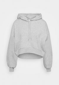 Hoodie grigia cropped con cappuccio regolabile, maniche ampie e orlo a costine. Realizzata in tessuto morbido con una trama liscia.