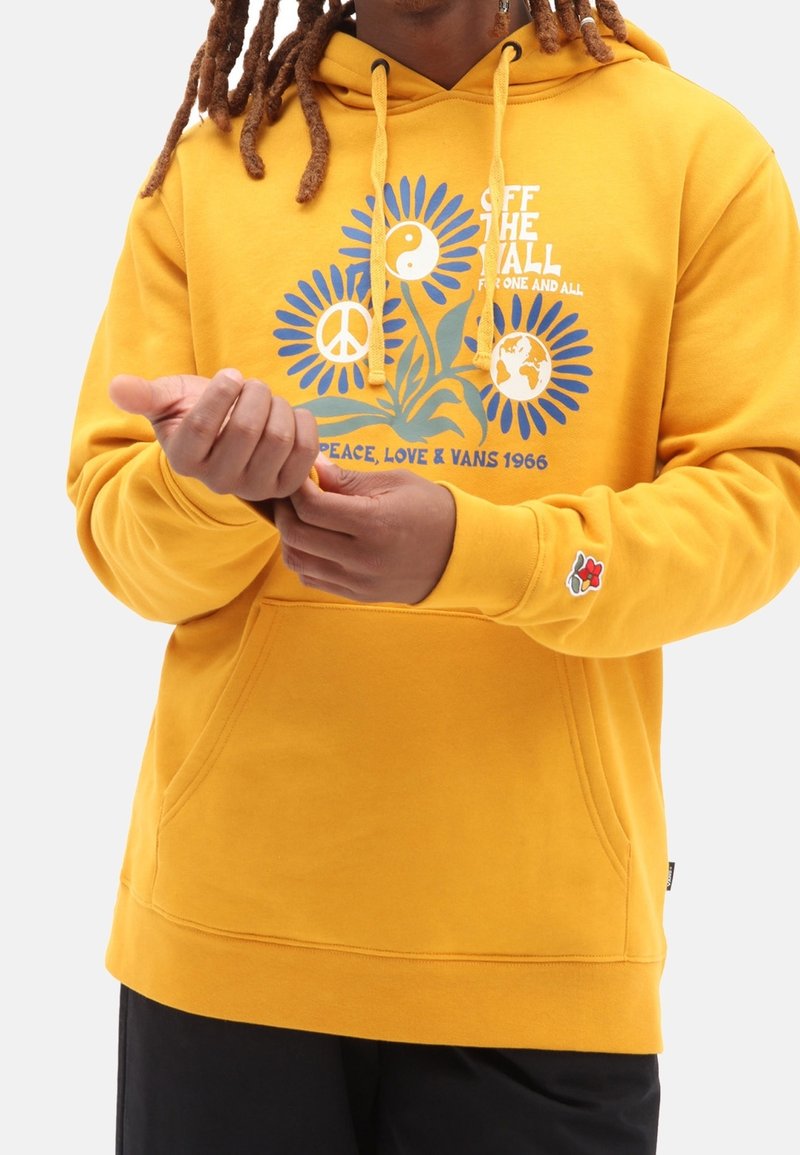 Yellow hoodie with graphic of flowers, peace symbol, and yin-yang. Features drawstrings, kangaroo pocket, and embroidered flower logo on sleeve.