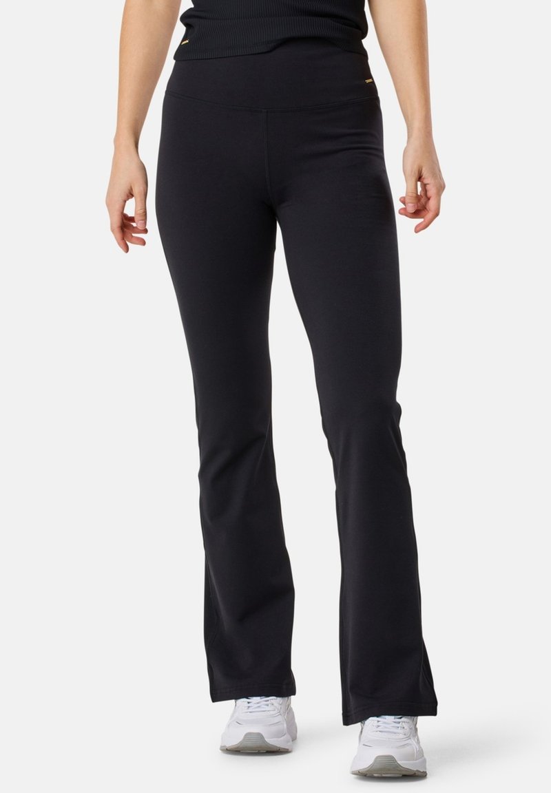 Pantaloni neri a palazzo realizzati in tessuto elasticizzato, con vita alta e delicati dettagli dorati sui fianchi. Texture liscia senza motivi.