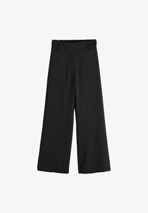 Black wide-leg trousers featuring white polka dots, elastic waistband with belt loops, and smooth texture. Flat front and two side pockets.