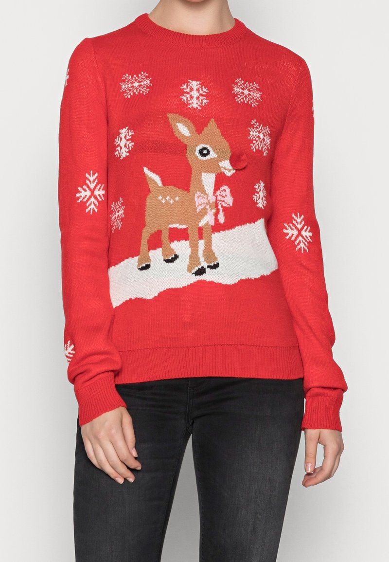 Red Christmas sweater with a cartoon reindeer featuring a red pom-pom nose, surrounded by white snowflakes and snow patches.